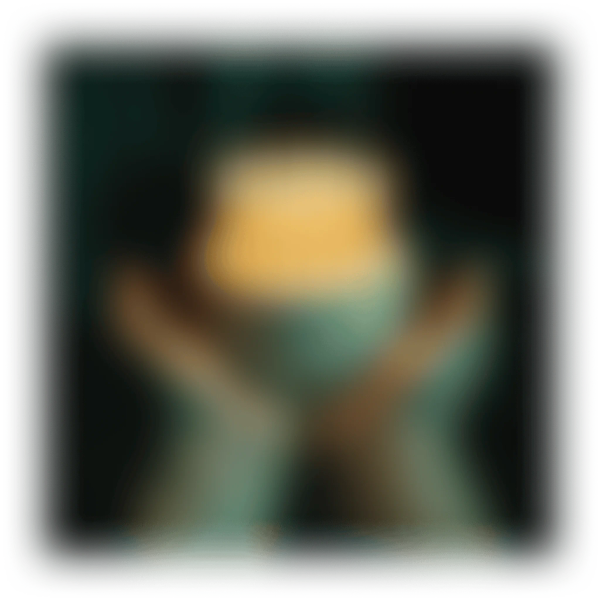Two hands holding an orange glowing object in a dark, blurry setting.